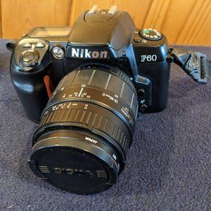 Nikon SLR F60 body for parts/repair.   Lens is in great condition.